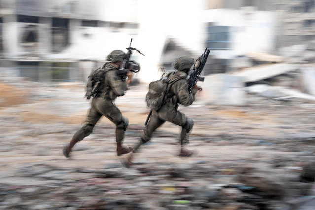 This handout picture released by the Israeli army on May 31, 2024 shows Israeli soldiers during operations in the Gaza Strip amid the ongoing conflict between Israel and the Palestinian militant group Hamas. (Photo by Israeli Army/AFP Photo)