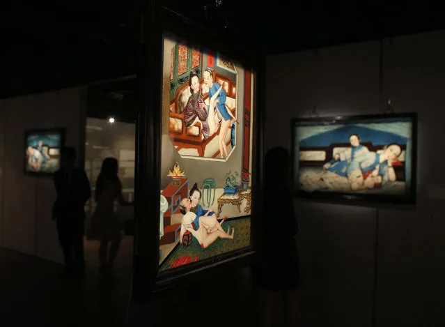 Erotic paintings are displayed at the preview of an exhibition entitled “Gardens of Pleasure: s*x in Ancient China”, at Sotheby's Hong Kong Gallery in Hong Kong April 15, 2014. More than 100 pieces with objects dating from China's Han Dynasty to Qing Dynasty are shown from the Ferdinand Bertholet Collection. (Photo by Bobby Yip/Reuters)