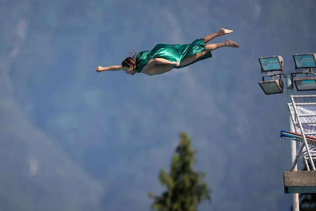 Andreas Hullinger of Switzerland dives at the Lugano Cliff Diving in Carona, Switzerland, on Saturday, August 21, 2021. (Photo by Massimo Piccoli/Keystone via AP Photo)