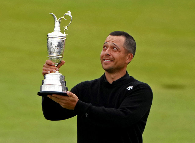 Xander Schauffele of the U.S celebrates with the Claret Jug trophy after winning The 152nd Open Championship in Troon, Scotland on July 21, 2024. (Photo by Maja Smiejkowska/Reuters)