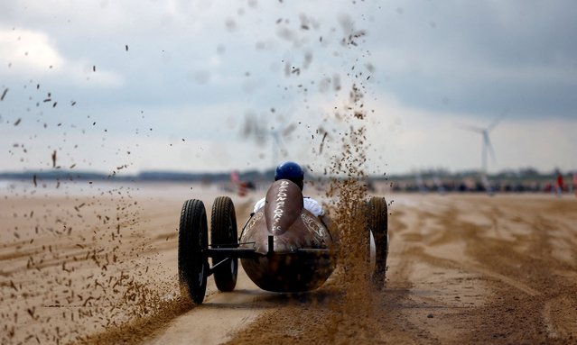 A motoring enthusiast takes part in the “Race The Waves” classic car and motorcycle meet at the beach in Bridlington, Britain on April 22, 2023. (Photo by Lee Smith/Reuters)