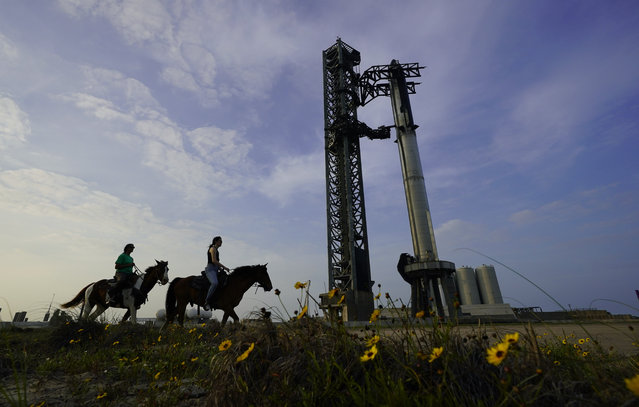 NASA Astronaut Sunita Williams, left, and Haley Esparza, right, ride horseback as they visit SpaceX's Starship, the world's biggest and most powerful rocket, as it is readied for launch at Starbase in Boca Chica, Texas, Wednesday, April 19, 2023. (Photo by Eric Gay/AP Photo)