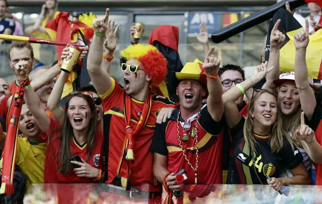 Belgian fans react after the group H World Cup soccer match between Belgium and Algeria at the Mineirao Stadium in Belo Horizonte, Brazil, Tuesday, June 17, 2014. Belgium won the match 2-1. (Photo by Hassan Ammar/AP Photo)