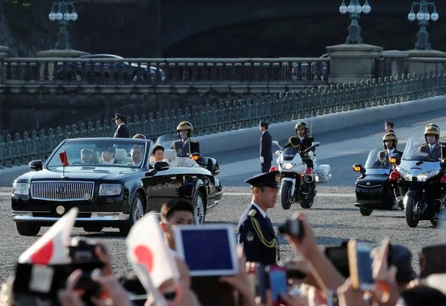 Japan's Emperor Naruhito and Empress Masako ride in a car during their royal parade to mark the enthronement of Japanese Emperor Naruhito in Tokyo, Japan on November 10, 2019. (Photo by Kim Kyung-Hoon/Reuters)