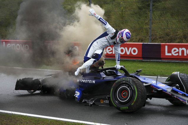Williams driver Logan Sargeant of the US jumps out of his car his car after a crash during the third free practice ahead of the Formula One Dutch Grand Prix race at the Zandvoort racetrack, Netherlands, Saturday, August 24, 2024. (Photo by Peter Dejong/AP Photo)
