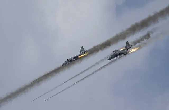 Russian Sukhoi Su-25 Frogfoot ground-attack planes perform during the Aviadarts military aviation competition at the Dubrovichi range near Ryazan, Russia, August 2, 2015. (Photo by Maxim Shemetov/Reuters)