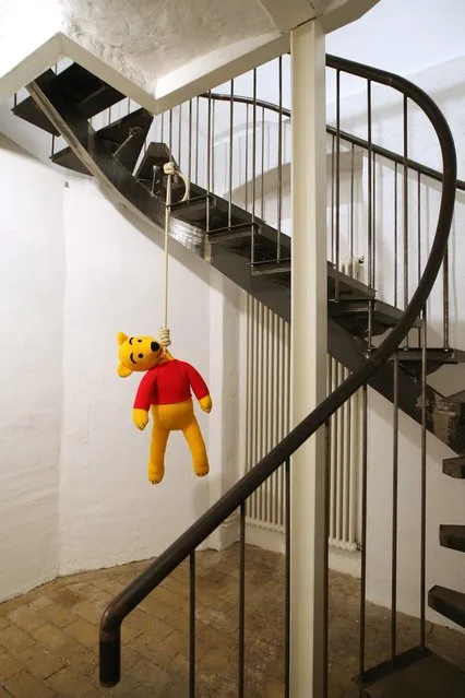 The knitted sculpture 'Winnie Pooh' by Patricia Waller, featuring the children's book character as a suicide victim, hangs in the 'Broken Heroes' exhibition at the Deschler Gallery