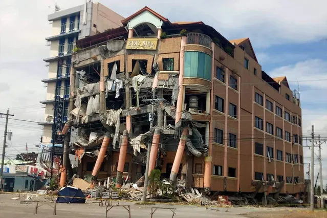Eva's Hotel stands damaged after a strong earthquake in Kidapawan, north Cotabato province, Philippines, Thursday, October 31, 2019. The third strong earthquake this month jolted the southern Philippines on Thursday morning, further damaging structures already weakened by the earlier shaking. (Photo by Williamor Magbanua/AP Photos)