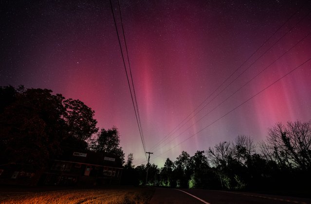 Perseid meteor shower is observed as Northern Lights (Aurora Borealis), colorful lights shift, illuminate the sky of New York, United States on August 12, 2024. (Photo by Fatih Aktas/Anadolu via Getty Images)