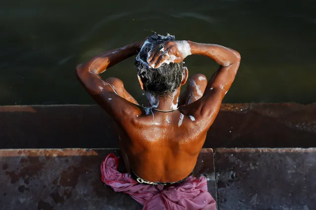 A man washes himself on the banks of the river Ganges in Varanasi, India, April 5, 2017. (Photo by Danish Siddiqui/Reuters)