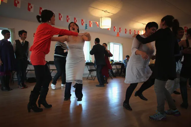 A wedding party enjoys music and dance on July 20, 2013 in Qeqertaq, Greenland. (Photo by Joe Raedle/Getty Images)