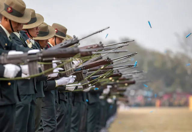 Nepalese Army soldiers fire during the grand rehearsal for Army Day celebrations in Kathmandu, Nepal, 18 February 2020. The Nepalese Army has been active since 1744 and is made up of about 95,000 army infantry and air service members. (Photo by Narendra Shrestha/EPA/EFE)