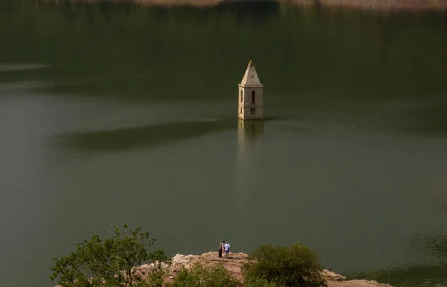 An 11th century Romanesque church, which is usually covered by water, is partially exposed in a reservoir in Vilanova de Sau, Catalonia, Spain, Monday, June 20, 2022. Spain's Ecological Transition ministry says 75% of Spanish land is vulnerable to desertification and this is increasing. (Photo by Emilio Morenatti/AP Photo)