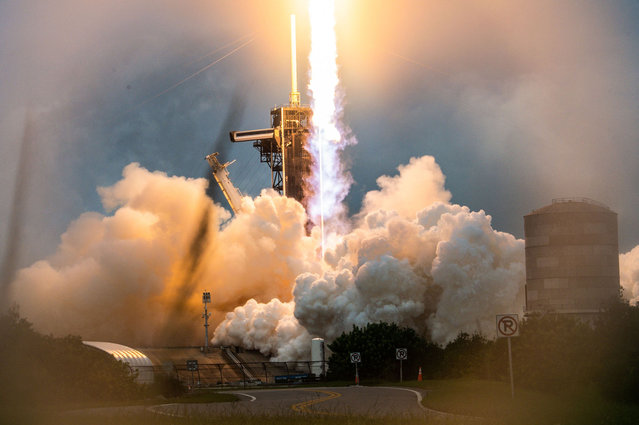 A SpaceX Falcon Heavy rocket with the Psyche spacecraft launches from NASA's Kennedy Space Center in Cape Canaveral, Florida, on October 13, 2023. The spacecraft is bound for Psyche, an object 2.2 billion miles (3.5 billion kilometers) away that could offer clues about the interior of planets like Earth. (Photo by Chandan Khanna/AFP Photo)