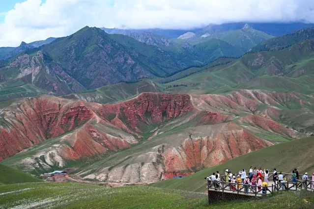 Tourists visit Zhuo'er Mountain scenic area in Qilian County of Haibei Tibetan Autonomous Prefecture, northwest China's Qinghai Province, August 10, 2022. (Photo by Xinhua News Agency/Rex Features/Shutterstock)