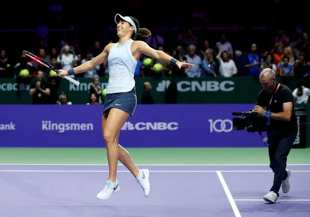 Caroline Garcia of France celebrates winning her group stage match against Caroline Wozniacki of Denmark during the WTA Finals tennis tournament in Singapore on October 27, 2017. (Photo by Edgar Su/Reuters)