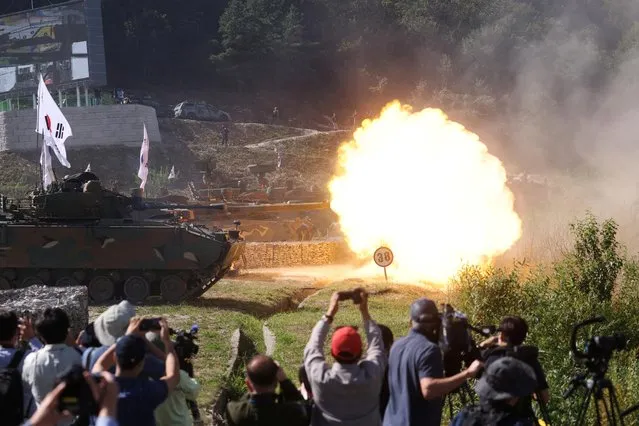 A South Korean army K2 tank fires during a live-fire military exercise which is a part of Defense Expo Korea (DX Korea) at a training field near the demilitarized zone separating the two Koreas in Pocheon, South Korea on September 20, 2022. (Photo by Kim Hong-Ji/Reuters)