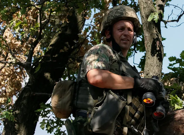 Ukrainian serviceman is seen at his position on the front line in Krasnogorivka near Donetsk, Ukraine, August 12, 2016. (Photo by Gleb Garanich/Reuters)