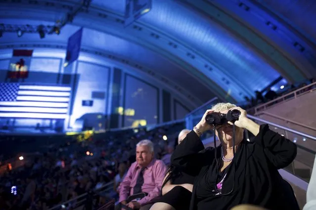 A woman looks towards the stage with binoculars less than five minutes before broadcast of the 95th Miss America Pageant at Boardwalk Hall, in Atlantic City, New Jersey, September 13, 2015. (Photo by Mark Makela/Reuters)