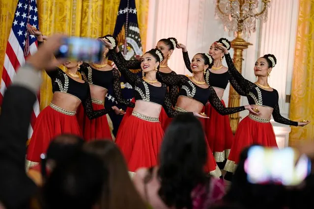 Dancers perform during an event to celebrate Diwali, in the East Room of the White House, Monday, October 24, 2022, in Washington. (Photo by Evan Vucci/AP Photo)