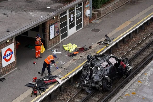 A general view of the crash site where a Range Rover veered off the road onto the Piccadilly Line train track after colliding with a Tesla, at Park Royal Station in West London, Britain on August 22, 2022. (Photo by Maja Smiejkowska/Reuters)