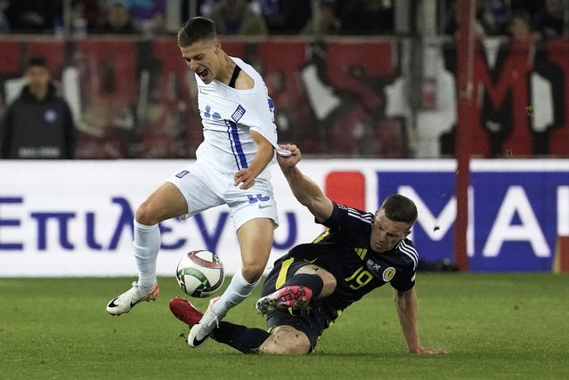 Greece's Giannis Konstantelias, left, duels for the ball with Scotland's Lewis Ferguson during the Nations League play off first leg soccer match between Greece and Scotland, at the Georgios Karaiskakis stadium at Athens' port of Piraeus, Greece, Thursday, March 20, 2025. (Photo by Petros Giannakouris/AP Photo)