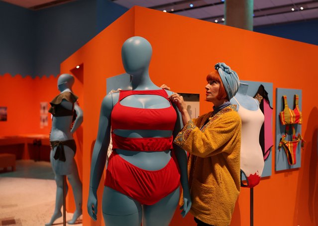 British fashion expert and guest curator Amber Butchart poses with “Cruz suit?” (2021) by Chromat x Tourmaline, a swimsuit on display at the Splash! A Century of Swimming and Style exhibition which will begin at the Design Museum in London, Britain, on March 24, 2025. (Photo by Isabel Infantes/Reuters)