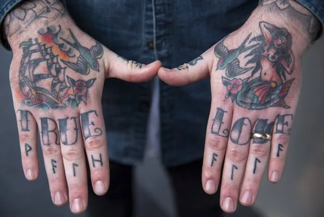 Tattoos are pictured on an attendee's hands during the International London Tattoo Convention in east London, Britain September 26, 2015. (Photo by Neil Hall/Reuters)