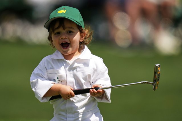 Max Homa's son, Cam Homa, holds his club on the green on the seventh hole during par-3 contest at the Masters golf tournament, Wednesday, April 9, 2025, in Augusta, Ga. (Photo by Julia Demaree Nikhinson/AP Photo)