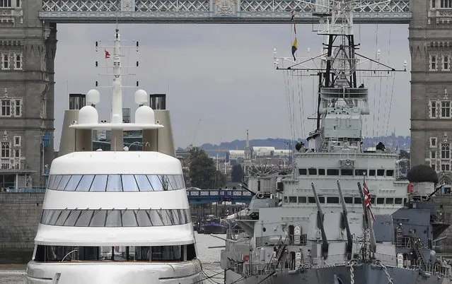 Superyacht Motor Yacht A (L), owned by Russian tycoon Andrey Melnichenko, is seen moored on the River Thames besides HMS Belfast in London, Britain September 6, 2016. (Photo by Toby Melville/Reuters)