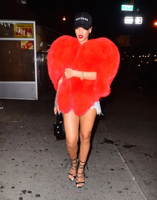 Rihanna was spotted leaving 1Oak in NYC with a fuzzy red heart jacket on September 5, 2016. Under it, she had daisy dukes and a black tank top. She looked great as she walked out with her BFF Melissa forde. She wore a black baseball cap to complete her hot look. (Photo by 247PAPS.TV/Splash News)