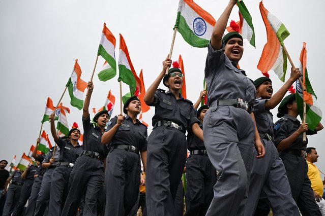 National Cadet Corps (NCC) cadets waving Indian national flags take part in a rally along the Kartavya Path near India Gate, expressing solidarity with the armed forces in New Delhi on May 13, 2025, following a ceasefire between Pakistan and India. (Photo by Arun Sankar/AFP Photo)