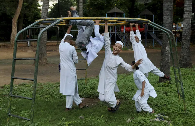 Indian Muslim children, who study at Jamia Masjid or the Grand Mosque, play at a ground in front of the mosque in Bangalore, India, Tuesday, October 6, 2015. The chief cleric of Bangalore's main mosque said Tuesday that he has advised the heads of hundreds of mosques in India's technology hub to actively counter propaganda by extremist Islamic groups by reaching out to young people in colleges and on social media. (Photo by Aijaz Rahi/AP Photo)