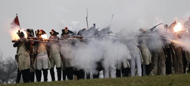 History enthusiasts, dressed as soldiers, fight during the re-enactment of Napoleon's famous battle of Austerlitz near the southern Moravian town of Slavkov u Brna November 29, 2014. (Photo by David W. Cerny/Reuters)