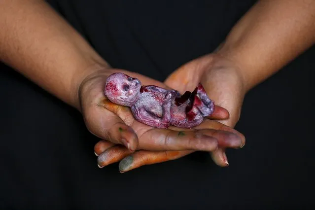 A bloody fetus made of gummy candy and red jelly is pictured at the Zombie Gourmet homemade candy manufacturer on the outskirts of Mexico City October 30, 2015. (Photo by Carlos Jasso/Reuters)