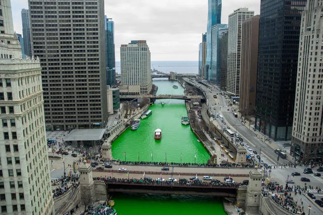 As is the tradition, the Chicago River was dyed green to celebrate St Patrick's Day on March 11, 2023. Mobs of people headed downtown to experience this manmade phenomenon. Many a leprechun were spotted in the hordes. The dying of the River was followed by the St.Patrick's Day Parade starting at Balbo and Columbus Drive. (Photo by Karen I Hirsch/ZUMA Press Wire/Rex Features/Shutterstock)