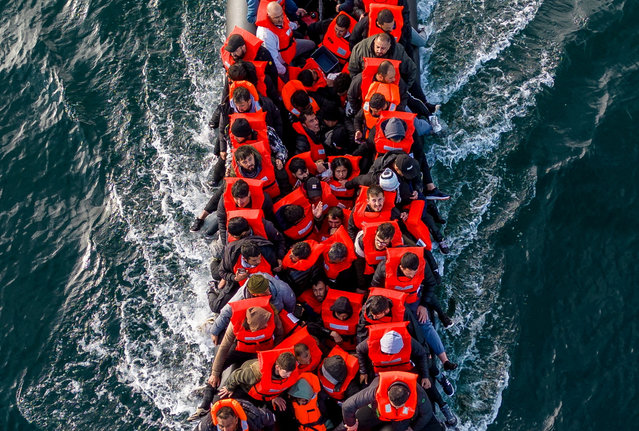 An inflatable dinghy carrying migrants makes its way towards England in the English Channel, Britain on May 4, 2024. (Photo by Chris J. Ratcliffe/Reuters)