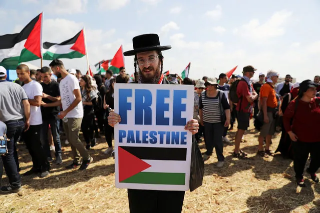A demonstrator takes part in a rally of Israeli Arabs calling for the right of return for refugees who fled their homes during the 1948 Arab-Israeli War, near Atlit, Israel April 19, 2018. (Photo by Ammar Awad/Reuters)