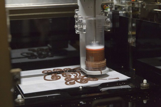 A 3D food printer by XYZprinting Inc. is demonstrated during the 2015 International Consumer Electronics Show (CES) in Las Vegas, Nevada January 4, 2015. The printer is expected to be available in the third quarter of 2015 but a price has not yet been established, a representative said. (Photo by Steve Marcus/Reuters)