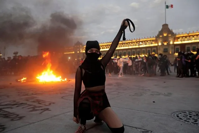 A woman gestures during a protest to mark the International Day for the Elimination of Violence against Women, in Mexico City, Mexico on November 25, 2020. (Photo by Mahe Elipe/Reuters)