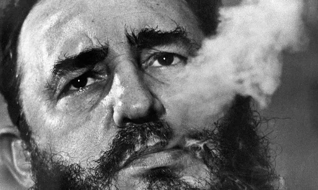 In this March 1985 file photo, Cuban Prime Minister Fidel Castro exhales cigar smoke during an interview at his presidential palace in Havana, Cuba. Castro, a Havana attorney who fought for the poor, overthrew dictator Fulgencio Batista's government on Jan. 1, 1959. Castro formally stepped down in 2008 after suffering gastrointestinal ailments and public appearances have been increasingly unusual in recent years. Cuban President Raul Castro has announced the death of his brother Fidel Castro at age 90 on Cuban state media on Friday, Nov. 25, 2016. (Photo by Charles Tasnadi/AP Photo)