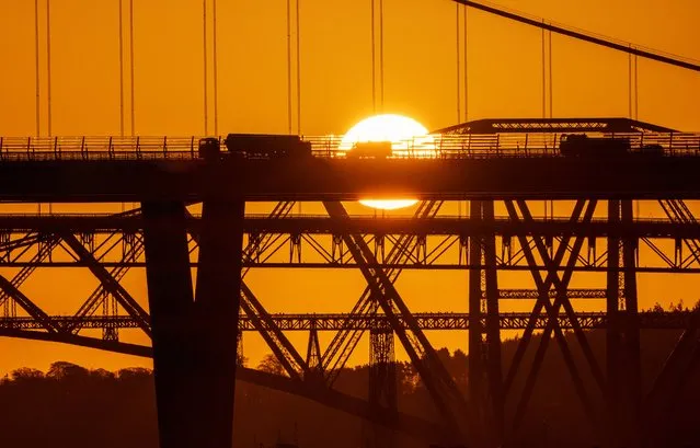 Sunrise over the Queensferry Crossing, Forth Road Bridge and Forth Bridge on the Firth of Forth, South Queensferry, Edinburgh on Monday, March 27, 2023. (Photo by Jane Barlow/PA Images via Getty Images)