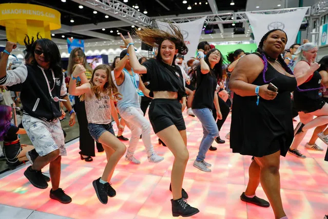 Attendees dance to K-pop songs at KCON USA, billed as the world's largest Korean culture convention and music festival, in Los Angeles, California on August 11, 2018. (Photo by Mike Blake/Reuters)