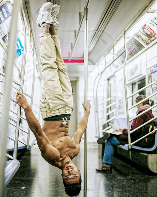 Yoga on the Underground, London. (Photo by Kristina Kashtanova/Caters News)