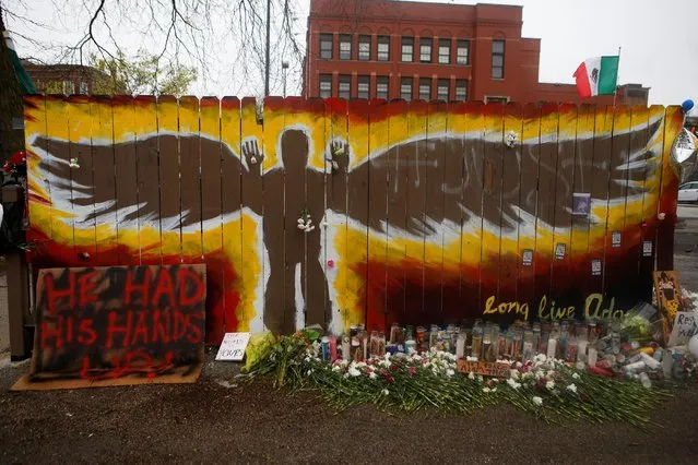 A memorial to 13-year-old Adam Toledo is growing at the site where he was shot dead by a police officer, in Chicago, Illinois, April 19, 2021. (Photo by Eileen T. Meslar/Reuters)