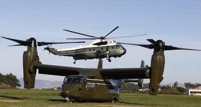 Marine One passes over an U.S. Marine Osprey as U.S. President Barack Obama returns to San Francisco after attending a Summit on Cybersecurity and Consumer Protection at Stanford University in Palo Alta, California February 13, 2015. (Photo by Kevin Lamarque/Reuters)