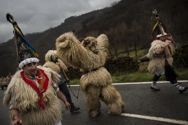 In this photo taken on Tuesday, January 27, 2015 Joaldunaks, some to call them “Zanpantzar”, take part on the Carnival between of the Pyrenees villages of Ituren and Zubieta, northern Spain. (Photo by Alvaro Barrientos/AP Photo)