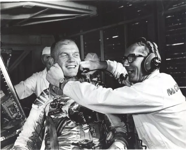 Guenter Wendt (R), the original pad leader for NASA's manned space program, coaxes a smile out of astronaut John Glenn after the MA-6 mission was scrubbed in Cape Canaveral, Florida, U.S. in this undated photo. (Photo by Reuters/NASA)