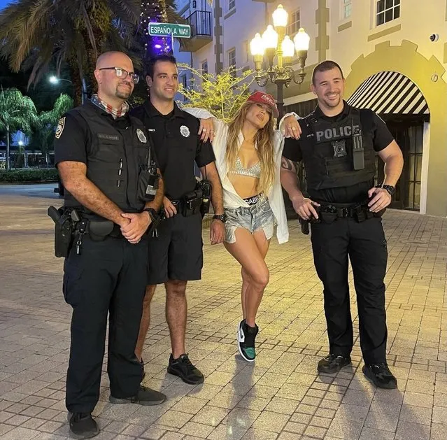 American singer and actress Jennifer Lopez poses for a photo with Miami Beach police on June 9, 2021. (Photo by Miami Beach police/The Mega Agency)