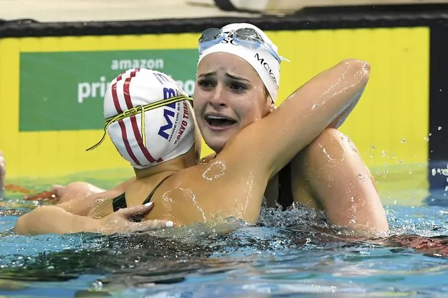 Kaylee McKeown, right, reacts with Minna Atherton after setting a new World Record in the Women's 100m Backstroke Final at the Australian Swimming Trials for Tokyo Olympic and Paralympic Games qualification, at the SA Aquatic and Leisure Centre in Adelaide, Sunday, June 13, 2021. (Photo by Dave Hunt/AAP Image via AP Photo)
